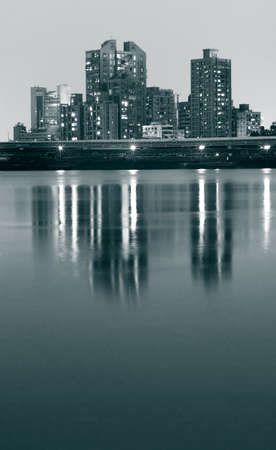 It is beautiful city night with river reflection.の写真素材