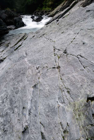 It is a beautiful river flow over the stone.の写真素材