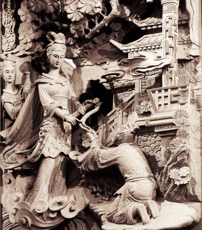 It is a stong carving of Taiwan. Maybe had one long story and fable.の写真素材