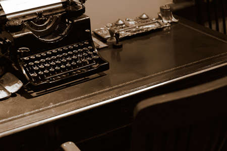 It is an old typewriter for bank on the desk.の写真素材
