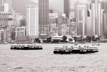 It is cityscape of two star ferry on Victoria harbor in Hong Kong.の写真素材