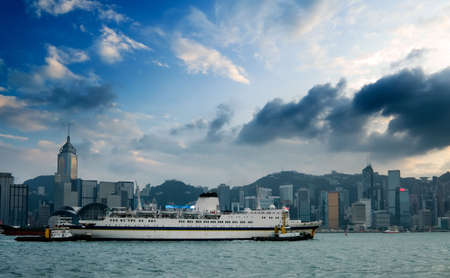 It is cityscape of Victoria harbor with big ship in Hong Kong.の写真素材