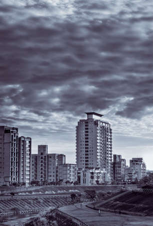 Taipei city scenery with buildings and park near river in Taiwan.の写真素材
