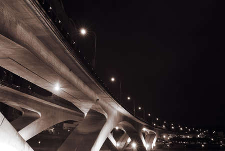 Cityscape of bridge with dark sky in the evening.