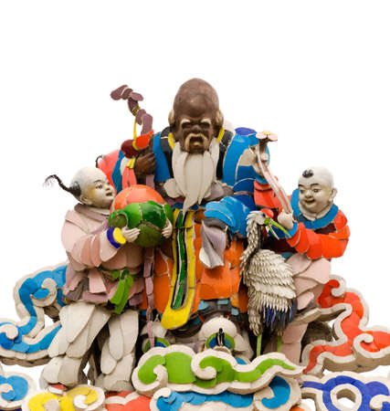 Three color Chinese god of elderly and children sculptures smile on Asian traditional temple roof...