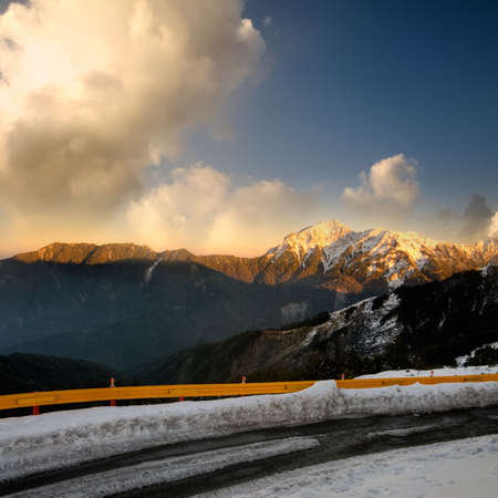 Landscape of dramatic scenery with orange sunset in snow peak in mountain Cilai, Taiwan, Asia.の写真素材