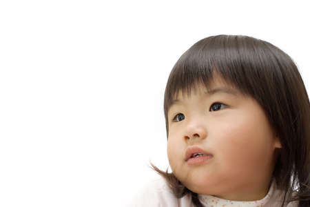 Asian children with hope face portrait in white background.の写真素材
