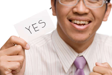 Business man show yes card on white background.の写真素材