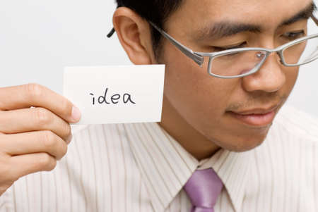 Idea concept holding by Asian business man.の写真素材