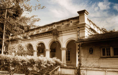 Old building of house in brown color under dramatic sky.の写真素材