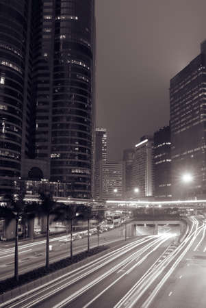 Modern city night with cars motion blurred.