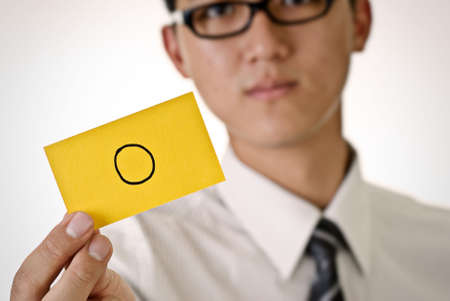 Accept pattern on yellow card hold by business man.の写真素材