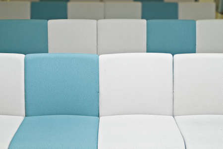 Empty chairs with white and blue color in office with nobody.