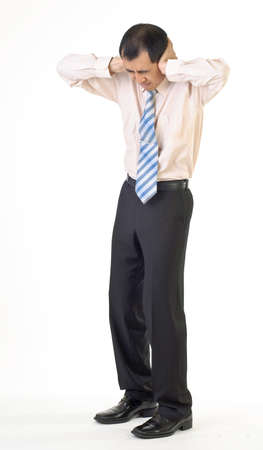 Business man under stress, full length portrait on white background.の写真素材
