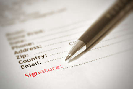 Signature on paper with pen in brown color.の写真素材