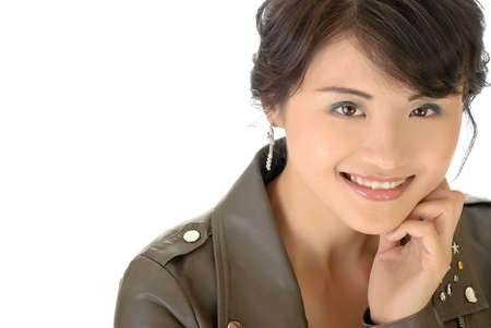 Smiling beauty face, closeup portrait of Asian woman on white background with copyspace.の写真素材