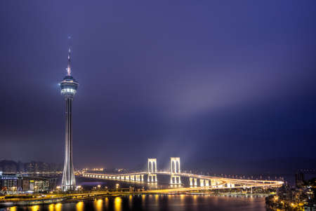 Macao landmark, travel tower in night, cityscape in Macau, China.のeditorial素材