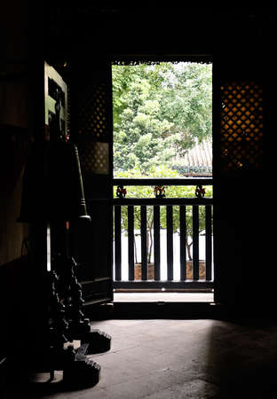 Building interior silhouette of Chinese temple and scenery of outside.の写真素材