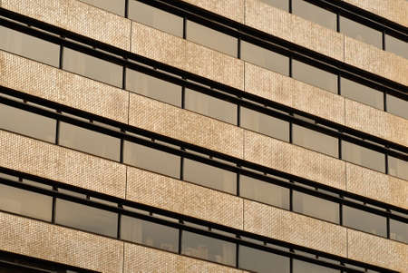 Business background of yellow wall and windows of office building.の写真素材