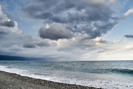 Bad weather seascape with cloudy sky and water wave.の写真素材