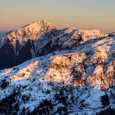 Mountain scenery of snow peak in winter in sunset in Taiwan, Asia.の写真素材