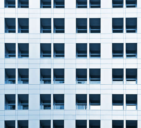 Architecture of office building exterior with pattern of windows.の写真素材