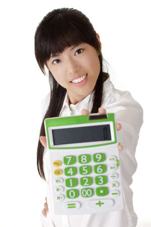 Attractive business woman holding calculator with friendly expression.の写真素材