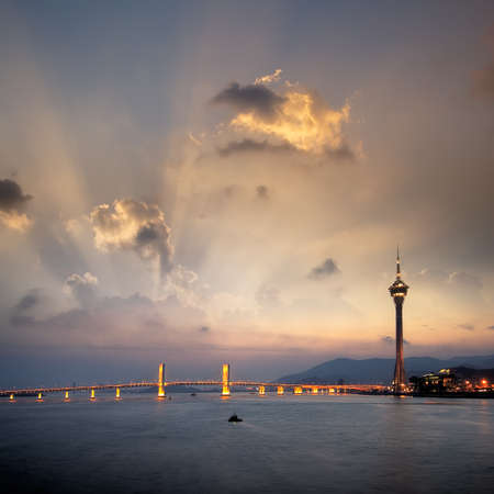 Cityscape of Macau with bridge and tower under sunset in Macao, Asia.の写真素材