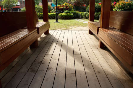 Wooden chair in park with shadow in morning.の写真素材