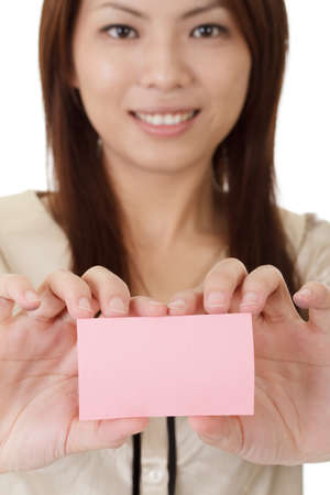 Young business woman holding blank card on hand.の写真素材