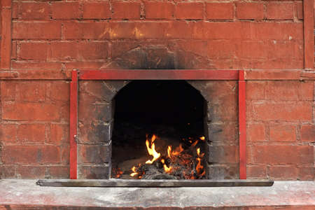 Chinese temple of fire burning in the brick stove.の写真素材