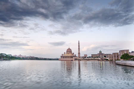 Landscape of mosque with river under blue sky in Putrajaya, Malaysia, Asia.の写真素材