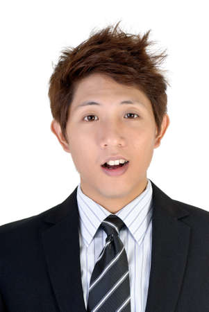 Surprised expression on young Asian executive, closeup portrait.の写真素材