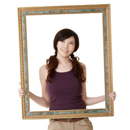 Wooden frame with young woman, closeup portrait on white background.の写真素材