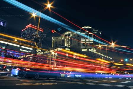 Colorful city night with lights of cars motion blurred in Taipei, Taiwan, Asia.