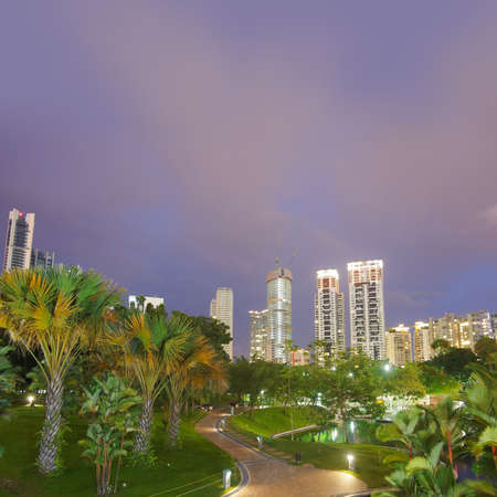 Colorful city night scene with modern buildings and green trees in park In Kuala Lumpur, Malaysia, Asia.の写真素材