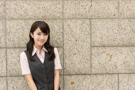 Successful business woman of Asian, closeup portrait in urban.の写真素材