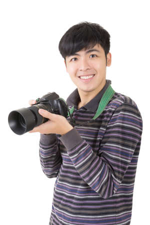 Young amateur photographer of Asian hold a camera, closeup portrait on white background.の写真素材