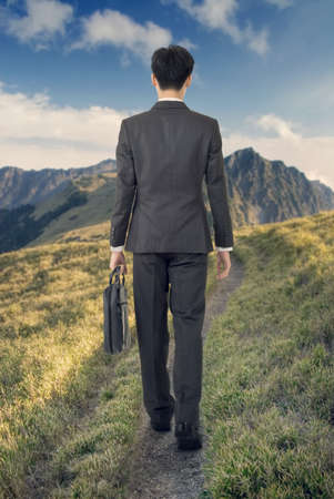One business man walk at mountain lane in outdoor の写真素材