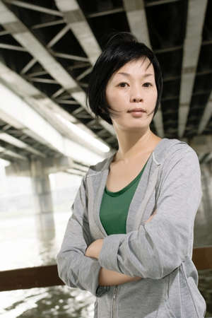 Portrait of sport mature Asian woman in outdoor in daytime.