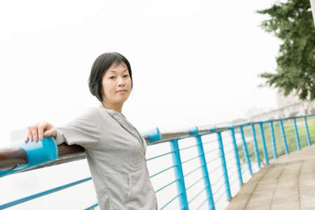 Portrait of sport mature Asian woman in outdoor in daytime.の写真素材