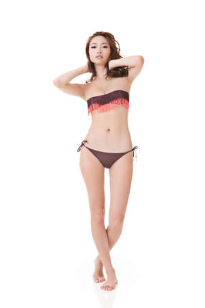 Summer bikini woman, full length portrait isolated on white background.の写真素材