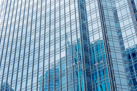 Modern skyscraper exterior with glass and reflection in daytime のeditorial素材