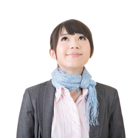 Pretty charming asian business woman looking up. Closeup portrait. Isolated on the white background.の写真素材
