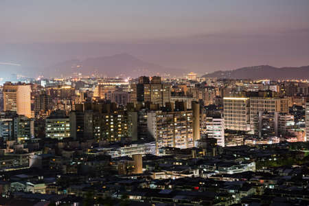 Urban scenery with skyscrapers and apartments in night, Taipei, Taiwan.の写真素材
