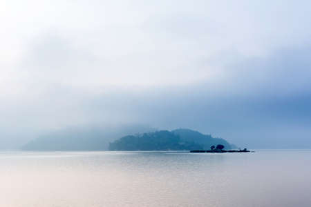 Landscape of famous Sun Moon Lake in the morning with mist in Taiwan, Asia.の写真素材
