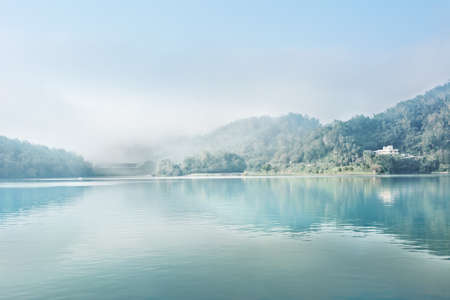Landscape of famous Sun Moon Lake in the morning with mist in Taiwan, Asia.の写真素材