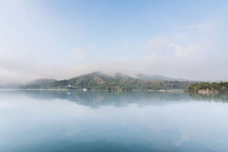 Landscape of famous Sun Moon Lake in the morning with mist in Taiwan, Asia.の写真素材