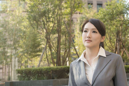 Asian business woman thinking in the city.の写真素材