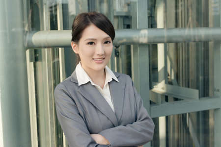 Friendly business woman of Asian with copyspace in modern city.の写真素材